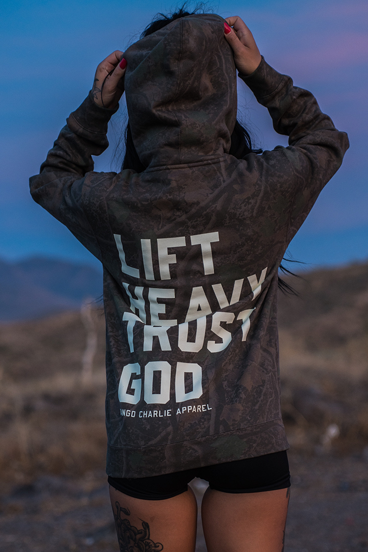 Lift Heavy. Trust God. - Premium Darkwood Camo Hoodie