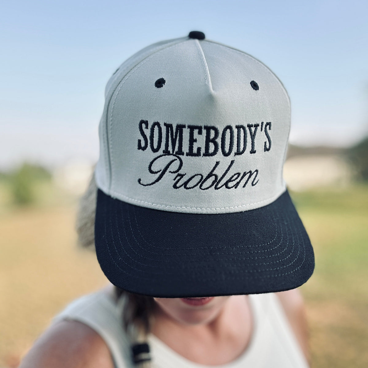 Somebody's Problem Snapback Hat