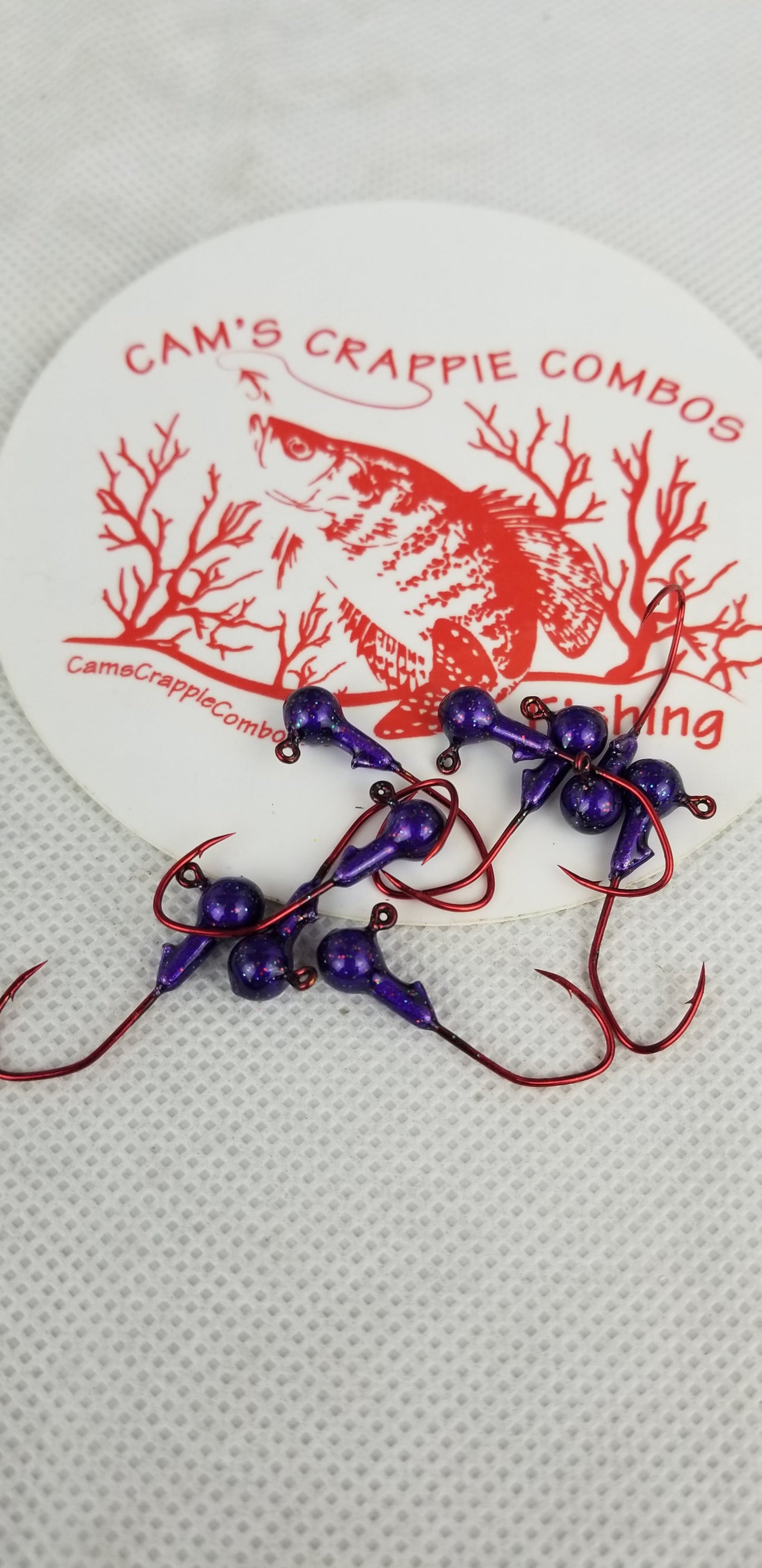 35 pk. 1/32 oz. Cam's "PURPLE PASSION" Painted jigs with Collar and #2 Red Chrome "NASTY BEND HOOK"