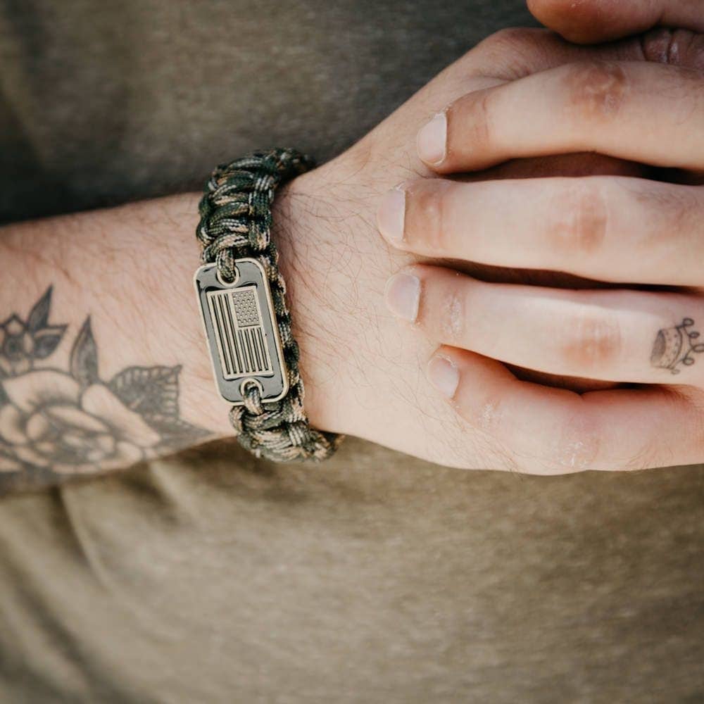 The Hero Company-Camo Paracord Bronze Flag Bracelet- Helps Pair Veterans With A Companion Dog