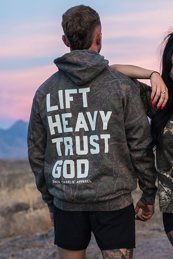 Lift Heavy. Trust God. - Premium Darkwood Camo Hoodie