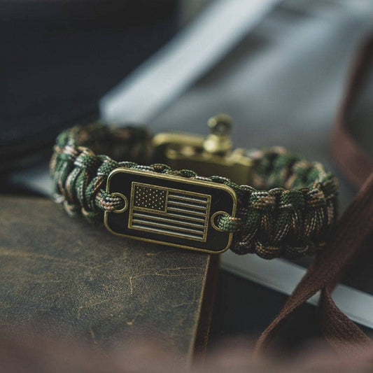 The Hero Company-Camo Paracord Bronze Flag Bracelet- Helps Pair Veterans With A Companion Dog